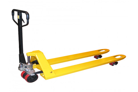 Durable pallet jack moving loads in industrial warehouse facility
